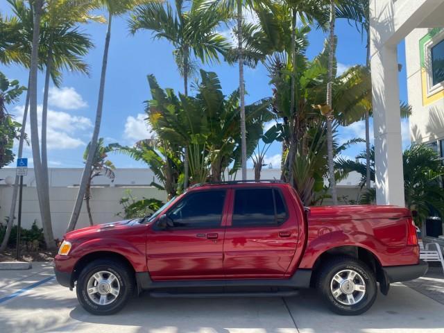 2003 Red Fire Metallic /Medium Flint Ford Explorer Sport Trac XLT LOW MILES 59,213 (1FMZU67E23U) with an 4.0L SOHC MPFI V6 Engine engine, Automatic transmission, located at 4701 North Dixie Hwy, Pompano Beach, FL, 33064, (954) 422-2889, 26.240938, -80.123474 - OUR WEBPAGE FLORIDACARS1.COM HAS OVER 100 PHOTOS AND FREE CARFAX LINK 2003 Ford Explorer Sport Trac XLT Sport Pickup 4.0L V6 F SOHC Gasoline 21 MPG Rear Wheel Drive Features ABS Brakes Air Conditioning Alloy Wheels AM/FM Stereo Automatic Transmission Bed Cover Bed Liner CD Audio Cloth Seats Cruise C - Photo#30