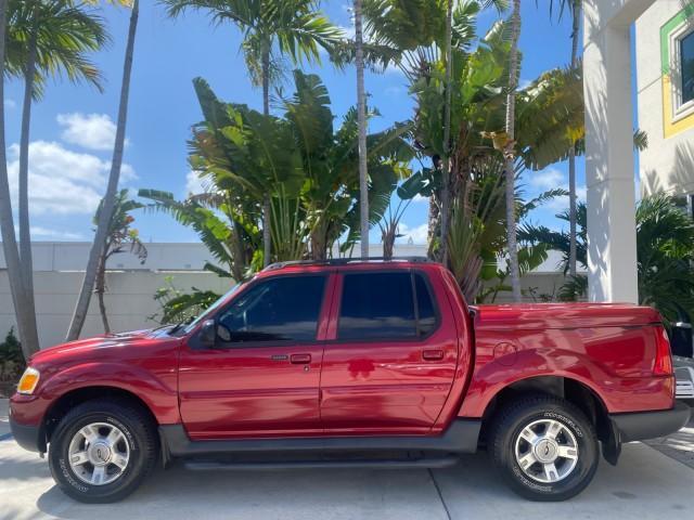 2003 Red Fire Metallic /Medium Flint Ford Explorer Sport Trac XLT LOW MILES 59,213 (1FMZU67E23U) with an 4.0L SOHC MPFI V6 Engine engine, Automatic transmission, located at 4701 North Dixie Hwy, Pompano Beach, FL, 33064, (954) 422-2889, 26.240938, -80.123474 - OUR WEBPAGE FLORIDACARS1.COM HAS OVER 100 PHOTOS AND FREE CARFAX LINK 2003 Ford Explorer Sport Trac XLT Sport Pickup 4.0L V6 F SOHC Gasoline 21 MPG Rear Wheel Drive Features ABS Brakes Air Conditioning Alloy Wheels AM/FM Stereo Automatic Transmission Bed Cover Bed Liner CD Audio Cloth Seats Cruise C - Photo#31