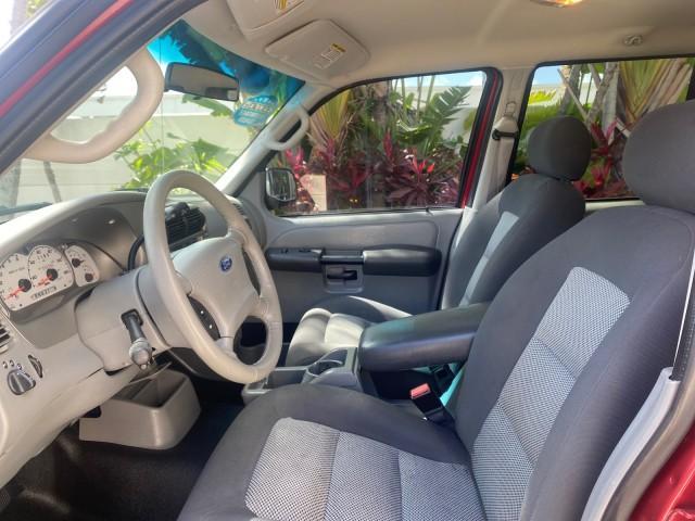 2003 Red Fire Metallic /Medium Flint Ford Explorer Sport Trac XLT LOW MILES 59,213 (1FMZU67E23U) with an 4.0L SOHC MPFI V6 Engine engine, Automatic transmission, located at 4701 North Dixie Hwy, Pompano Beach, FL, 33064, (954) 422-2889, 26.240938, -80.123474 - OUR WEBPAGE FLORIDACARS1.COM HAS OVER 100 PHOTOS AND FREE CARFAX LINK 2003 Ford Explorer Sport Trac XLT Sport Pickup 4.0L V6 F SOHC Gasoline 21 MPG Rear Wheel Drive Features ABS Brakes Air Conditioning Alloy Wheels AM/FM Stereo Automatic Transmission Bed Cover Bed Liner CD Audio Cloth Seats Cruise C - Photo#47