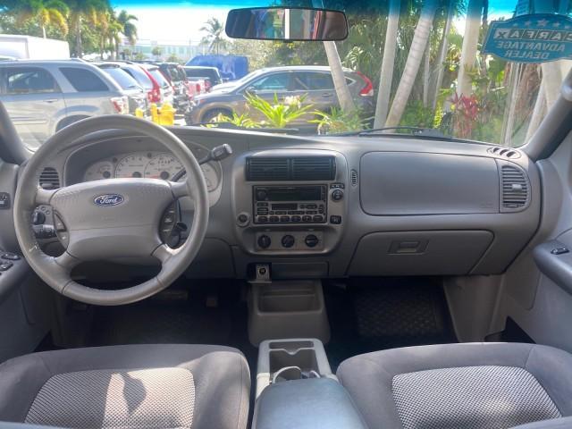 2003 Red Fire Metallic /Medium Flint Ford Explorer Sport Trac XLT LOW MILES 59,213 (1FMZU67E23U) with an 4.0L SOHC MPFI V6 Engine engine, Automatic transmission, located at 4701 North Dixie Hwy, Pompano Beach, FL, 33064, (954) 422-2889, 26.240938, -80.123474 - OUR WEBPAGE FLORIDACARS1.COM HAS OVER 100 PHOTOS AND FREE CARFAX LINK 2003 Ford Explorer Sport Trac XLT Sport Pickup 4.0L V6 F SOHC Gasoline 21 MPG Rear Wheel Drive Features ABS Brakes Air Conditioning Alloy Wheels AM/FM Stereo Automatic Transmission Bed Cover Bed Liner CD Audio Cloth Seats Cruise C - Photo#81