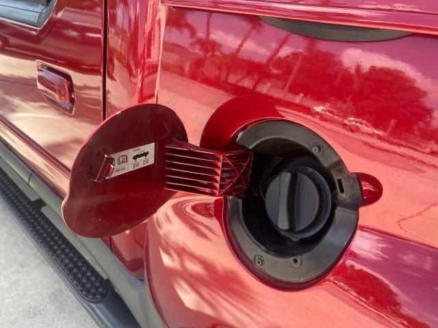 2003 Red Fire Metallic /Medium Flint Ford Explorer Sport Trac XLT LOW MILES 59,213 (1FMZU67E23U) with an 4.0L SOHC MPFI V6 Engine engine, Automatic transmission, located at 4701 North Dixie Hwy, Pompano Beach, FL, 33064, (954) 422-2889, 26.240938, -80.123474 - OUR WEBPAGE FLORIDACARS1.COM HAS OVER 100 PHOTOS AND FREE CARFAX LINK 2003 Ford Explorer Sport Trac XLT Sport Pickup 4.0L V6 F SOHC Gasoline 21 MPG Rear Wheel Drive Features ABS Brakes Air Conditioning Alloy Wheels AM/FM Stereo Automatic Transmission Bed Cover Bed Liner CD Audio Cloth Seats Cruise C - Photo#83