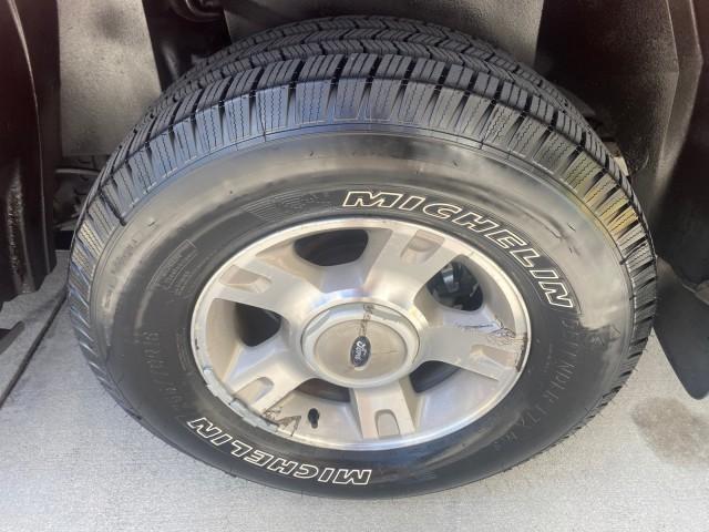 2003 Red Fire Metallic /Medium Flint Ford Explorer Sport Trac XLT LOW MILES 59,213 (1FMZU67E23U) with an 4.0L SOHC MPFI V6 Engine engine, Automatic transmission, located at 4701 North Dixie Hwy, Pompano Beach, FL, 33064, (954) 422-2889, 26.240938, -80.123474 - OUR WEBPAGE FLORIDACARS1.COM HAS OVER 100 PHOTOS AND FREE CARFAX LINK 2003 Ford Explorer Sport Trac XLT Sport Pickup 4.0L V6 F SOHC Gasoline 21 MPG Rear Wheel Drive Features ABS Brakes Air Conditioning Alloy Wheels AM/FM Stereo Automatic Transmission Bed Cover Bed Liner CD Audio Cloth Seats Cruise C - Photo#84