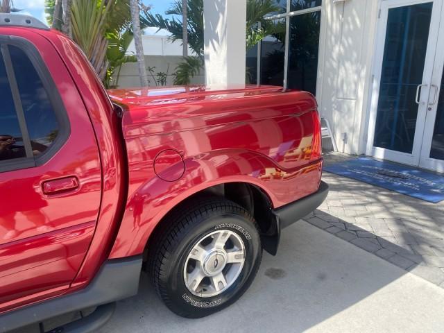 2003 Red Fire Metallic /Medium Flint Ford Explorer Sport Trac XLT LOW MILES 59,213 (1FMZU67E23U) with an 4.0L SOHC MPFI V6 Engine engine, Automatic transmission, located at 4701 North Dixie Hwy, Pompano Beach, FL, 33064, (954) 422-2889, 26.240938, -80.123474 - OUR WEBPAGE FLORIDACARS1.COM HAS OVER 100 PHOTOS AND FREE CARFAX LINK 2003 Ford Explorer Sport Trac XLT Sport Pickup 4.0L V6 F SOHC Gasoline 21 MPG Rear Wheel Drive Features ABS Brakes Air Conditioning Alloy Wheels AM/FM Stereo Automatic Transmission Bed Cover Bed Liner CD Audio Cloth Seats Cruise C - Photo#88