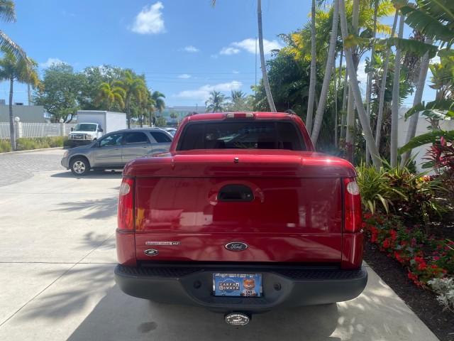 2003 Red Fire Metallic /Medium Flint Ford Explorer Sport Trac XLT LOW MILES 59,213 (1FMZU67E23U) with an 4.0L SOHC MPFI V6 Engine engine, Automatic transmission, located at 4701 North Dixie Hwy, Pompano Beach, FL, 33064, (954) 422-2889, 26.240938, -80.123474 - OUR WEBPAGE FLORIDACARS1.COM HAS OVER 100 PHOTOS AND FREE CARFAX LINK 2003 Ford Explorer Sport Trac XLT Sport Pickup 4.0L V6 F SOHC Gasoline 21 MPG Rear Wheel Drive Features ABS Brakes Air Conditioning Alloy Wheels AM/FM Stereo Automatic Transmission Bed Cover Bed Liner CD Audio Cloth Seats Cruise C - Photo#89
