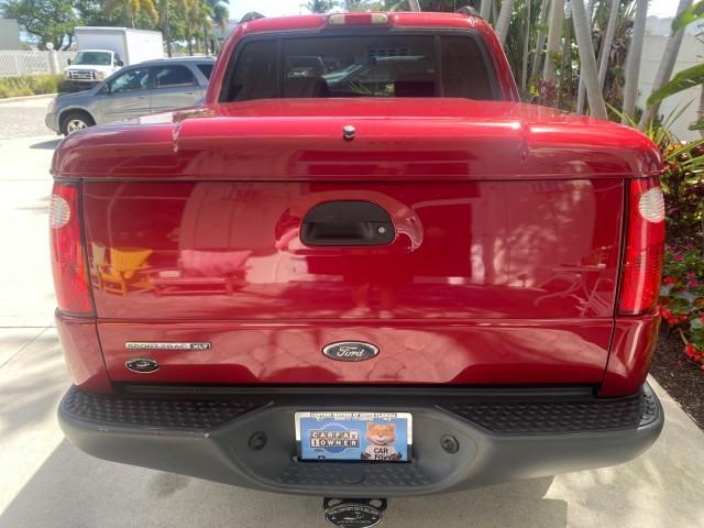 2003 Red Fire Metallic /Medium Flint Ford Explorer Sport Trac XLT LOW MILES 59,213 (1FMZU67E23U) with an 4.0L SOHC MPFI V6 Engine engine, Automatic transmission, located at 4701 North Dixie Hwy, Pompano Beach, FL, 33064, (954) 422-2889, 26.240938, -80.123474 - OUR WEBPAGE FLORIDACARS1.COM HAS OVER 100 PHOTOS AND FREE CARFAX LINK 2003 Ford Explorer Sport Trac XLT Sport Pickup 4.0L V6 F SOHC Gasoline 21 MPG Rear Wheel Drive Features ABS Brakes Air Conditioning Alloy Wheels AM/FM Stereo Automatic Transmission Bed Cover Bed Liner CD Audio Cloth Seats Cruise C - Photo#90