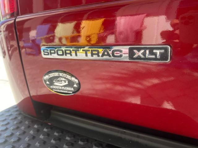 2003 Red Fire Metallic /Medium Flint Ford Explorer Sport Trac XLT LOW MILES 59,213 (1FMZU67E23U) with an 4.0L SOHC MPFI V6 Engine engine, Automatic transmission, located at 4701 North Dixie Hwy, Pompano Beach, FL, 33064, (954) 422-2889, 26.240938, -80.123474 - OUR WEBPAGE FLORIDACARS1.COM HAS OVER 100 PHOTOS AND FREE CARFAX LINK 2003 Ford Explorer Sport Trac XLT Sport Pickup 4.0L V6 F SOHC Gasoline 21 MPG Rear Wheel Drive Features ABS Brakes Air Conditioning Alloy Wheels AM/FM Stereo Automatic Transmission Bed Cover Bed Liner CD Audio Cloth Seats Cruise C - Photo#91