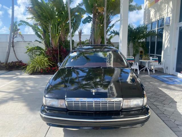 1993 Black /Red Chevrolet Caprice Classic STATON WAGON 1 OWNER (1G1BL8375PW) with an 5.7L V8 F OHV 16V engine, Automatic transmission, located at 4701 North Dixie Hwy, Pompano Beach, FL, 33064, (954) 422-2889, 26.240938, -80.123474 - OUR WEBPAGE FLORIDACARS1.COM HAS OVER 100 PHOTOS AND FREE CARFAX LINK 1993 Chevrolet Caprice -1 OWNER STATION WAGON REAR JUMP SEAT INCLUDED - NO ACCIDENTS EVER - VERY HARD COLOR COMBO TO FIND BLACK EXTERIOR RED INTERIOR Wagon 4 DR 5.7L V8 F OHV 16V Gasoline Rear Wheel Drive Features ABS Brakes Air C - Photo#2