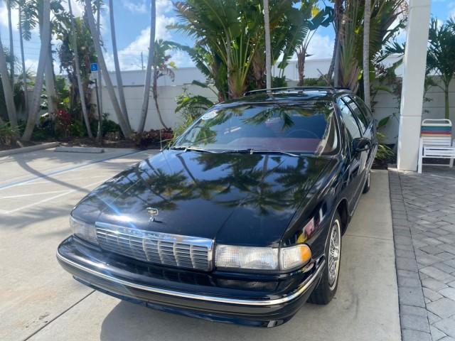 1993 Black /Red Chevrolet Caprice Classic STATON WAGON 1 OWNER (1G1BL8375PW) with an 5.7L V8 F OHV 16V engine, Automatic transmission, located at 4701 North Dixie Hwy, Pompano Beach, FL, 33064, (954) 422-2889, 26.240938, -80.123474 - OUR WEBPAGE FLORIDACARS1.COM HAS OVER 100 PHOTOS AND FREE CARFAX LINK 1993 Chevrolet Caprice -1 OWNER STATION WAGON REAR JUMP SEAT INCLUDED - NO ACCIDENTS EVER - VERY HARD COLOR COMBO TO FIND BLACK EXTERIOR RED INTERIOR Wagon 4 DR 5.7L V8 F OHV 16V Gasoline Rear Wheel Drive Features ABS Brakes Air C - Photo#3