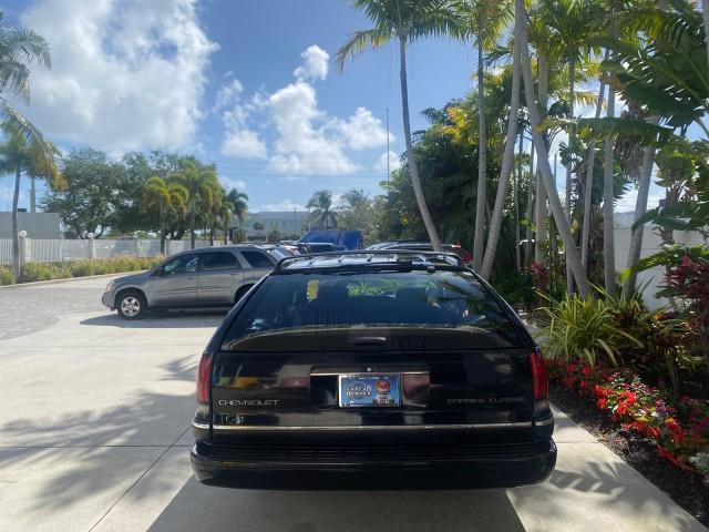 1993 Black /Red Chevrolet Caprice Classic STATON WAGON 1 OWNER (1G1BL8375PW) with an 5.7L V8 F OHV 16V engine, Automatic transmission, located at 4701 North Dixie Hwy, Pompano Beach, FL, 33064, (954) 422-2889, 26.240938, -80.123474 - OUR WEBPAGE FLORIDACARS1.COM HAS OVER 100 PHOTOS AND FREE CARFAX LINK 1993 Chevrolet Caprice -1 OWNER STATION WAGON REAR JUMP SEAT INCLUDED - NO ACCIDENTS EVER - VERY HARD COLOR COMBO TO FIND BLACK EXTERIOR RED INTERIOR Wagon 4 DR 5.7L V8 F OHV 16V Gasoline Rear Wheel Drive Features ABS Brakes Air C - Photo#6