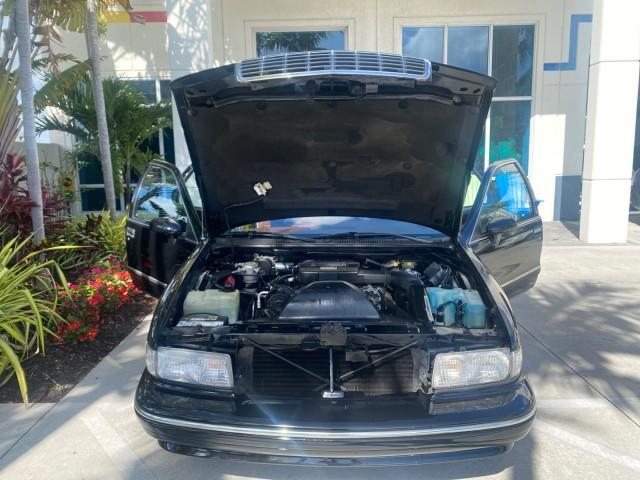 1993 Black /Red Chevrolet Caprice Classic STATON WAGON 1 OWNER (1G1BL8375PW) with an 5.7L V8 F OHV 16V engine, Automatic transmission, located at 4701 North Dixie Hwy, Pompano Beach, FL, 33064, (954) 422-2889, 26.240938, -80.123474 - OUR WEBPAGE FLORIDACARS1.COM HAS OVER 100 PHOTOS AND FREE CARFAX LINK 1993 Chevrolet Caprice -1 OWNER STATION WAGON REAR JUMP SEAT INCLUDED - NO ACCIDENTS EVER - VERY HARD COLOR COMBO TO FIND BLACK EXTERIOR RED INTERIOR Wagon 4 DR 5.7L V8 F OHV 16V Gasoline Rear Wheel Drive Features ABS Brakes Air C - Photo#17