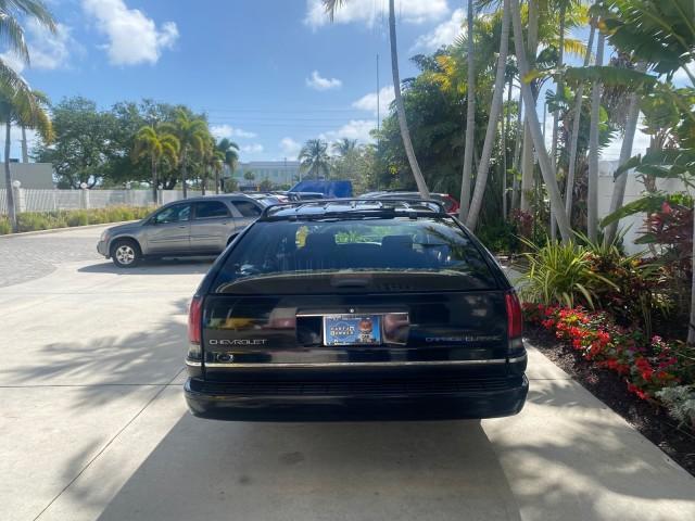 1993 Black /Red Chevrolet Caprice Classic STATON WAGON 1 OWNER (1G1BL8375PW) with an 5.7L V8 F OHV 16V engine, Automatic transmission, located at 4701 North Dixie Hwy, Pompano Beach, FL, 33064, (954) 422-2889, 26.240938, -80.123474 - OUR WEBPAGE FLORIDACARS1.COM HAS OVER 100 PHOTOS AND FREE CARFAX LINK 1993 Chevrolet Caprice -1 OWNER STATION WAGON REAR JUMP SEAT INCLUDED - NO ACCIDENTS EVER - VERY HARD COLOR COMBO TO FIND BLACK EXTERIOR RED INTERIOR Wagon 4 DR 5.7L V8 F OHV 16V Gasoline Rear Wheel Drive Features ABS Brakes Air C - Photo#34
