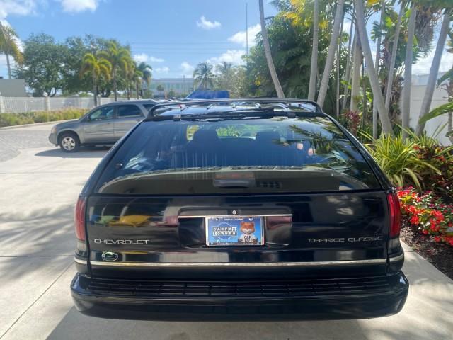 1993 Black /Red Chevrolet Caprice Classic STATON WAGON 1 OWNER (1G1BL8375PW) with an 5.7L V8 F OHV 16V engine, Automatic transmission, located at 4701 North Dixie Hwy, Pompano Beach, FL, 33064, (954) 422-2889, 26.240938, -80.123474 - OUR WEBPAGE FLORIDACARS1.COM HAS OVER 100 PHOTOS AND FREE CARFAX LINK 1993 Chevrolet Caprice -1 OWNER STATION WAGON REAR JUMP SEAT INCLUDED - NO ACCIDENTS EVER - VERY HARD COLOR COMBO TO FIND BLACK EXTERIOR RED INTERIOR Wagon 4 DR 5.7L V8 F OHV 16V Gasoline Rear Wheel Drive Features ABS Brakes Air C - Photo#35