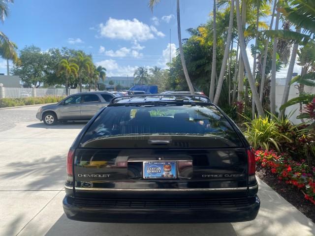 1993 Black /Red Chevrolet Caprice Classic STATON WAGON 1 OWNER (1G1BL8375PW) with an 5.7L V8 F OHV 16V engine, Automatic transmission, located at 4701 North Dixie Hwy, Pompano Beach, FL, 33064, (954) 422-2889, 26.240938, -80.123474 - OUR WEBPAGE FLORIDACARS1.COM HAS OVER 100 PHOTOS AND FREE CARFAX LINK 1993 Chevrolet Caprice -1 OWNER STATION WAGON REAR JUMP SEAT INCLUDED - NO ACCIDENTS EVER - VERY HARD COLOR COMBO TO FIND BLACK EXTERIOR RED INTERIOR Wagon 4 DR 5.7L V8 F OHV 16V Gasoline Rear Wheel Drive Features ABS Brakes Air C - Photo#84