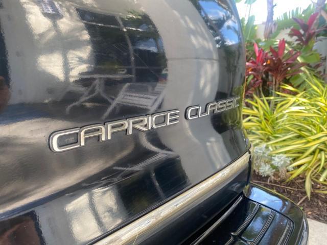 1993 Black /Red Chevrolet Caprice Classic STATON WAGON 1 OWNER (1G1BL8375PW) with an 5.7L V8 F OHV 16V engine, Automatic transmission, located at 4701 North Dixie Hwy, Pompano Beach, FL, 33064, (954) 422-2889, 26.240938, -80.123474 - OUR WEBPAGE FLORIDACARS1.COM HAS OVER 100 PHOTOS AND FREE CARFAX LINK 1993 Chevrolet Caprice -1 OWNER STATION WAGON REAR JUMP SEAT INCLUDED - NO ACCIDENTS EVER - VERY HARD COLOR COMBO TO FIND BLACK EXTERIOR RED INTERIOR Wagon 4 DR 5.7L V8 F OHV 16V Gasoline Rear Wheel Drive Features ABS Brakes Air C - Photo#87