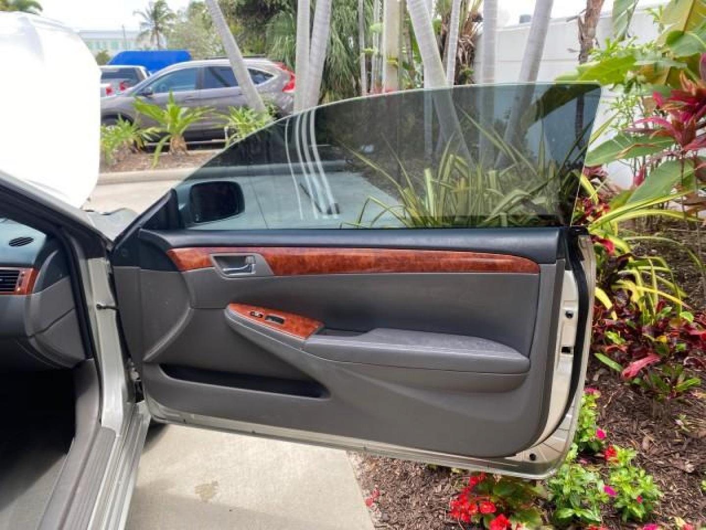 2006 Lunar Mist Metallic /Dark Stone Toyota Camry Solara SLE V6 LOW MILES 54,978 1 OWNER (4T1FA38P36U) with an 3.3L DOHC SMPI 24-Valve V6 Engine engine, Automatic transmission, located at 4701 North Dixie Hwy, Pompano Beach, FL, 33064, (954) 422-2889, 26.240938, -80.123474 - OUR WEBPAGE FLORIDACARS1.COM HAS OVER 100 PHOTOS AND FREE CARFAX LINK 2006 Toyota Camry Solara SLE V6 1 OWNER LEATHER LOADED ABSOLUTELY NO CRACKS ON THE DASH Convertible 3.3L V6 F DOHC 24V Gasoline 28 MPG Front Wheel Drive Features ABS Brakes Air Conditioning Alloy Wheels AM/FM Stereo Automatic Tran - Photo#10