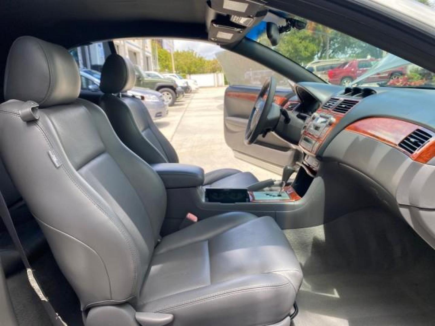 2006 Lunar Mist Metallic /Dark Stone Toyota Camry Solara SLE V6 LOW MILES 54,978 1 OWNER (4T1FA38P36U) with an 3.3L DOHC SMPI 24-Valve V6 Engine engine, Automatic transmission, located at 4701 North Dixie Hwy, Pompano Beach, FL, 33064, (954) 422-2889, 26.240938, -80.123474 - OUR WEBPAGE FLORIDACARS1.COM HAS OVER 100 PHOTOS AND FREE CARFAX LINK 2006 Toyota Camry Solara SLE V6 1 OWNER LEATHER LOADED ABSOLUTELY NO CRACKS ON THE DASH Convertible 3.3L V6 F DOHC 24V Gasoline 28 MPG Front Wheel Drive Features ABS Brakes Air Conditioning Alloy Wheels AM/FM Stereo Automatic Tran - Photo#11