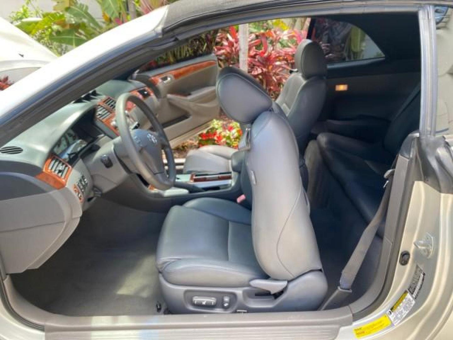 2006 Lunar Mist Metallic /Dark Stone Toyota Camry Solara SLE V6 LOW MILES 54,978 1 OWNER (4T1FA38P36U) with an 3.3L DOHC SMPI 24-Valve V6 Engine engine, Automatic transmission, located at 4701 North Dixie Hwy, Pompano Beach, FL, 33064, (954) 422-2889, 26.240938, -80.123474 - OUR WEBPAGE FLORIDACARS1.COM HAS OVER 100 PHOTOS AND FREE CARFAX LINK 2006 Toyota Camry Solara SLE V6 1 OWNER LEATHER LOADED ABSOLUTELY NO CRACKS ON THE DASH Convertible 3.3L V6 F DOHC 24V Gasoline 28 MPG Front Wheel Drive Features ABS Brakes Air Conditioning Alloy Wheels AM/FM Stereo Automatic Tran - Photo#12