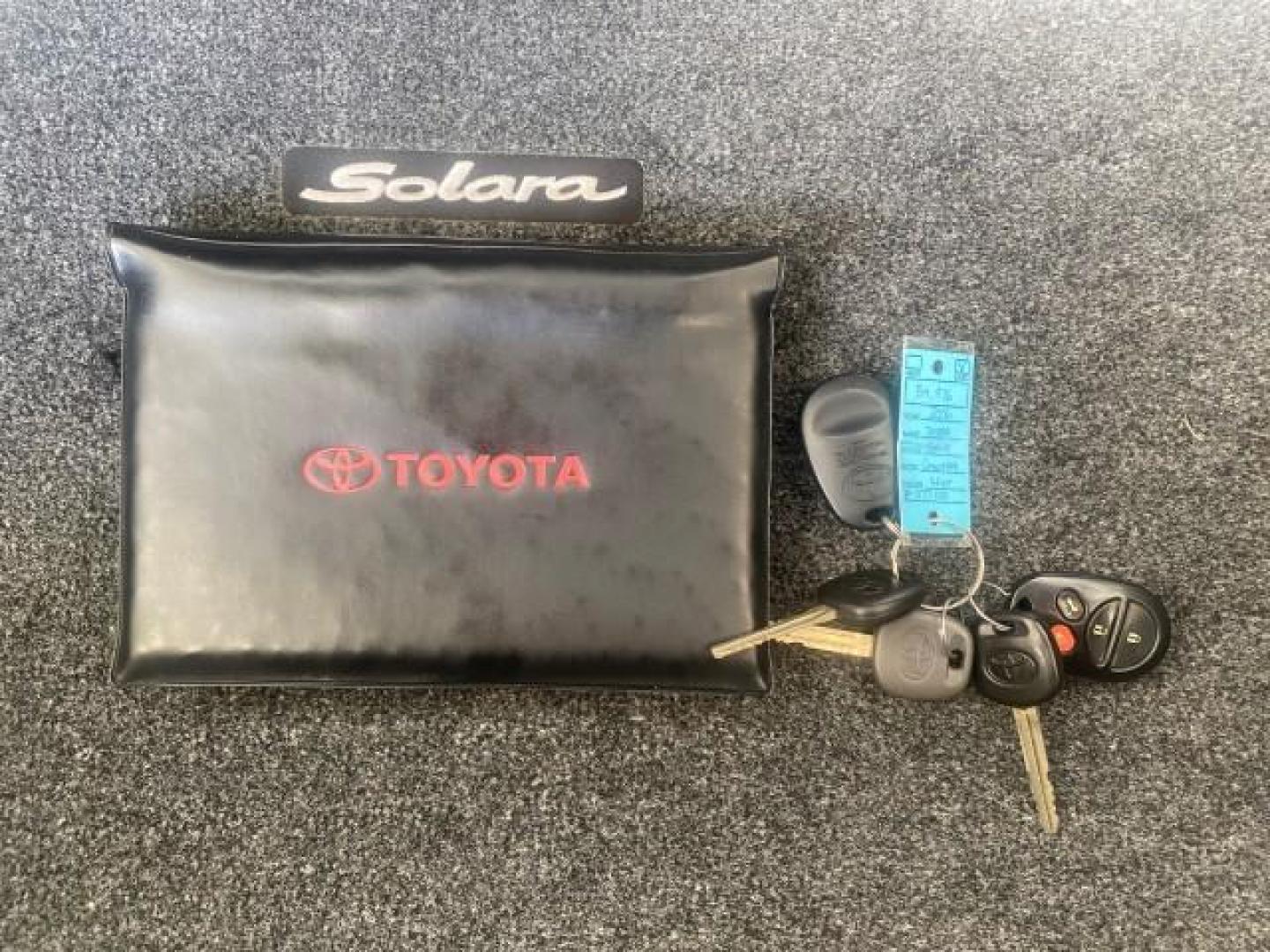 2006 Lunar Mist Metallic /Dark Stone Toyota Camry Solara SLE V6 LOW MILES 54,978 1 OWNER (4T1FA38P36U) with an 3.3L DOHC SMPI 24-Valve V6 Engine engine, Automatic transmission, located at 4701 North Dixie Hwy, Pompano Beach, FL, 33064, (954) 422-2889, 26.240938, -80.123474 - OUR WEBPAGE FLORIDACARS1.COM HAS OVER 100 PHOTOS AND FREE CARFAX LINK 2006 Toyota Camry Solara SLE V6 1 OWNER LEATHER LOADED ABSOLUTELY NO CRACKS ON THE DASH Convertible 3.3L V6 F DOHC 24V Gasoline 28 MPG Front Wheel Drive Features ABS Brakes Air Conditioning Alloy Wheels AM/FM Stereo Automatic Tran - Photo#23