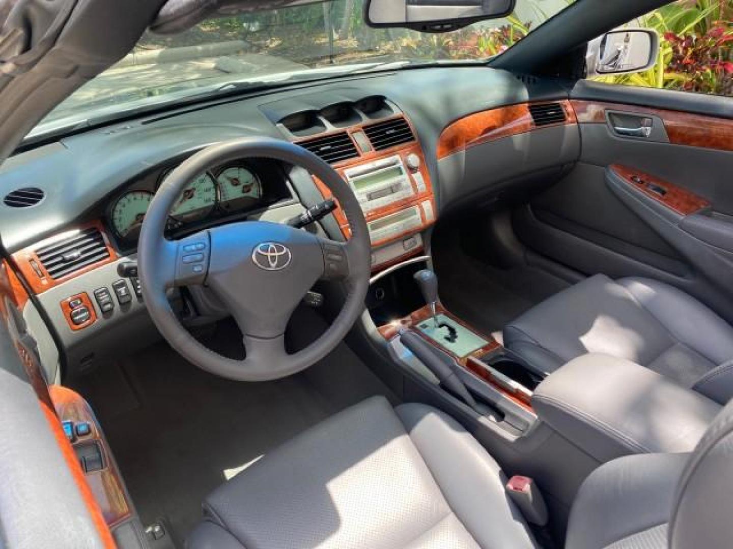 2006 Lunar Mist Metallic /Dark Stone Toyota Camry Solara SLE V6 LOW MILES 54,978 1 OWNER (4T1FA38P36U) with an 3.3L DOHC SMPI 24-Valve V6 Engine engine, Automatic transmission, located at 4701 North Dixie Hwy, Pompano Beach, FL, 33064, (954) 422-2889, 26.240938, -80.123474 - OUR WEBPAGE FLORIDACARS1.COM HAS OVER 100 PHOTOS AND FREE CARFAX LINK 2006 Toyota Camry Solara SLE V6 1 OWNER LEATHER LOADED ABSOLUTELY NO CRACKS ON THE DASH Convertible 3.3L V6 F DOHC 24V Gasoline 28 MPG Front Wheel Drive Features ABS Brakes Air Conditioning Alloy Wheels AM/FM Stereo Automatic Tran - Photo#49