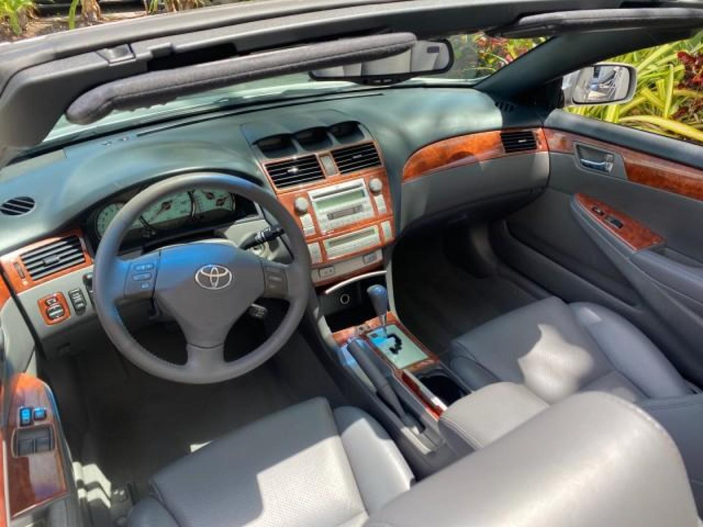 2006 Lunar Mist Metallic /Dark Stone Toyota Camry Solara SLE V6 LOW MILES 54,978 1 OWNER (4T1FA38P36U) with an 3.3L DOHC SMPI 24-Valve V6 Engine engine, Automatic transmission, located at 4701 North Dixie Hwy, Pompano Beach, FL, 33064, (954) 422-2889, 26.240938, -80.123474 - OUR WEBPAGE FLORIDACARS1.COM HAS OVER 100 PHOTOS AND FREE CARFAX LINK 2006 Toyota Camry Solara SLE V6 1 OWNER LEATHER LOADED ABSOLUTELY NO CRACKS ON THE DASH Convertible 3.3L V6 F DOHC 24V Gasoline 28 MPG Front Wheel Drive Features ABS Brakes Air Conditioning Alloy Wheels AM/FM Stereo Automatic Tran - Photo#50