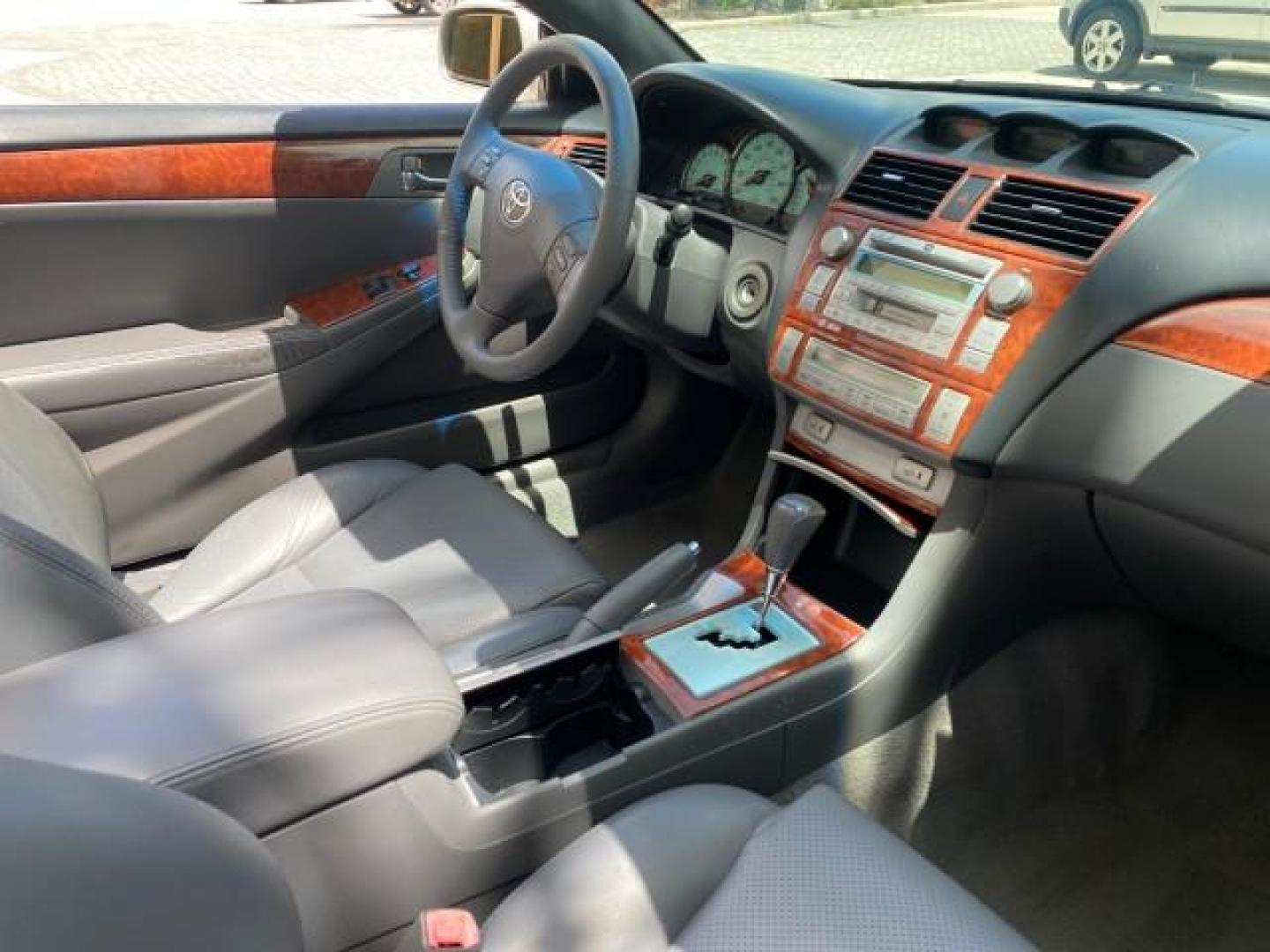 2006 Lunar Mist Metallic /Dark Stone Toyota Camry Solara SLE V6 LOW MILES 54,978 1 OWNER (4T1FA38P36U) with an 3.3L DOHC SMPI 24-Valve V6 Engine engine, Automatic transmission, located at 4701 North Dixie Hwy, Pompano Beach, FL, 33064, (954) 422-2889, 26.240938, -80.123474 - OUR WEBPAGE FLORIDACARS1.COM HAS OVER 100 PHOTOS AND FREE CARFAX LINK 2006 Toyota Camry Solara SLE V6 1 OWNER LEATHER LOADED ABSOLUTELY NO CRACKS ON THE DASH Convertible 3.3L V6 F DOHC 24V Gasoline 28 MPG Front Wheel Drive Features ABS Brakes Air Conditioning Alloy Wheels AM/FM Stereo Automatic Tran - Photo#52