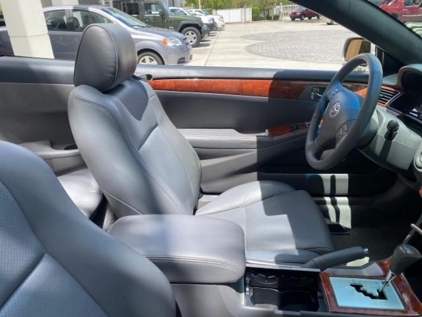 2006 Lunar Mist Metallic /Dark Stone Toyota Camry Solara SLE V6 LOW MILES 54,978 1 OWNER (4T1FA38P36U) with an 3.3L DOHC SMPI 24-Valve V6 Engine engine, Automatic transmission, located at 4701 North Dixie Hwy, Pompano Beach, FL, 33064, (954) 422-2889, 26.240938, -80.123474 - OUR WEBPAGE FLORIDACARS1.COM HAS OVER 100 PHOTOS AND FREE CARFAX LINK 2006 Toyota Camry Solara SLE V6 1 OWNER LEATHER LOADED ABSOLUTELY NO CRACKS ON THE DASH Convertible 3.3L V6 F DOHC 24V Gasoline 28 MPG Front Wheel Drive Features ABS Brakes Air Conditioning Alloy Wheels AM/FM Stereo Automatic Tran - Photo#53