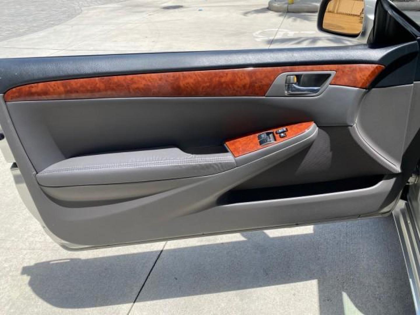 2006 Lunar Mist Metallic /Dark Stone Toyota Camry Solara SLE V6 LOW MILES 54,978 1 OWNER (4T1FA38P36U) with an 3.3L DOHC SMPI 24-Valve V6 Engine engine, Automatic transmission, located at 4701 North Dixie Hwy, Pompano Beach, FL, 33064, (954) 422-2889, 26.240938, -80.123474 - OUR WEBPAGE FLORIDACARS1.COM HAS OVER 100 PHOTOS AND FREE CARFAX LINK 2006 Toyota Camry Solara SLE V6 1 OWNER LEATHER LOADED ABSOLUTELY NO CRACKS ON THE DASH Convertible 3.3L V6 F DOHC 24V Gasoline 28 MPG Front Wheel Drive Features ABS Brakes Air Conditioning Alloy Wheels AM/FM Stereo Automatic Tran - Photo#60