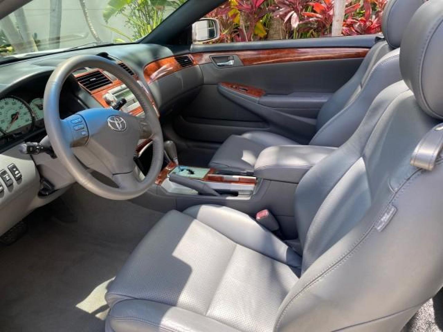 2006 Lunar Mist Metallic /Dark Stone Toyota Camry Solara SLE V6 LOW MILES 54,978 1 OWNER (4T1FA38P36U) with an 3.3L DOHC SMPI 24-Valve V6 Engine engine, Automatic transmission, located at 4701 North Dixie Hwy, Pompano Beach, FL, 33064, (954) 422-2889, 26.240938, -80.123474 - OUR WEBPAGE FLORIDACARS1.COM HAS OVER 100 PHOTOS AND FREE CARFAX LINK 2006 Toyota Camry Solara SLE V6 1 OWNER LEATHER LOADED ABSOLUTELY NO CRACKS ON THE DASH Convertible 3.3L V6 F DOHC 24V Gasoline 28 MPG Front Wheel Drive Features ABS Brakes Air Conditioning Alloy Wheels AM/FM Stereo Automatic Tran - Photo#63
