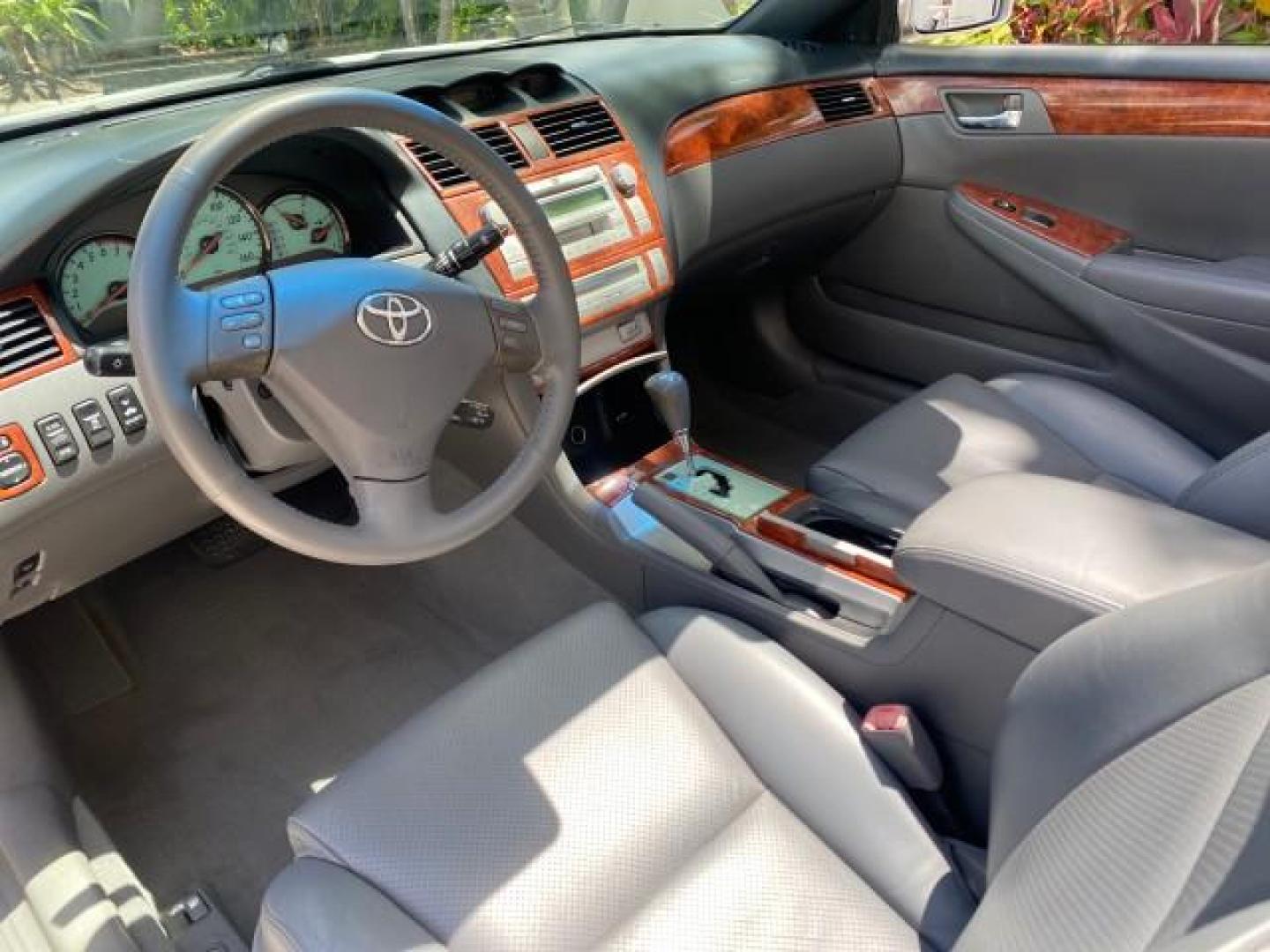 2006 Lunar Mist Metallic /Dark Stone Toyota Camry Solara SLE V6 LOW MILES 54,978 1 OWNER (4T1FA38P36U) with an 3.3L DOHC SMPI 24-Valve V6 Engine engine, Automatic transmission, located at 4701 North Dixie Hwy, Pompano Beach, FL, 33064, (954) 422-2889, 26.240938, -80.123474 - OUR WEBPAGE FLORIDACARS1.COM HAS OVER 100 PHOTOS AND FREE CARFAX LINK 2006 Toyota Camry Solara SLE V6 1 OWNER LEATHER LOADED ABSOLUTELY NO CRACKS ON THE DASH Convertible 3.3L V6 F DOHC 24V Gasoline 28 MPG Front Wheel Drive Features ABS Brakes Air Conditioning Alloy Wheels AM/FM Stereo Automatic Tran - Photo#65