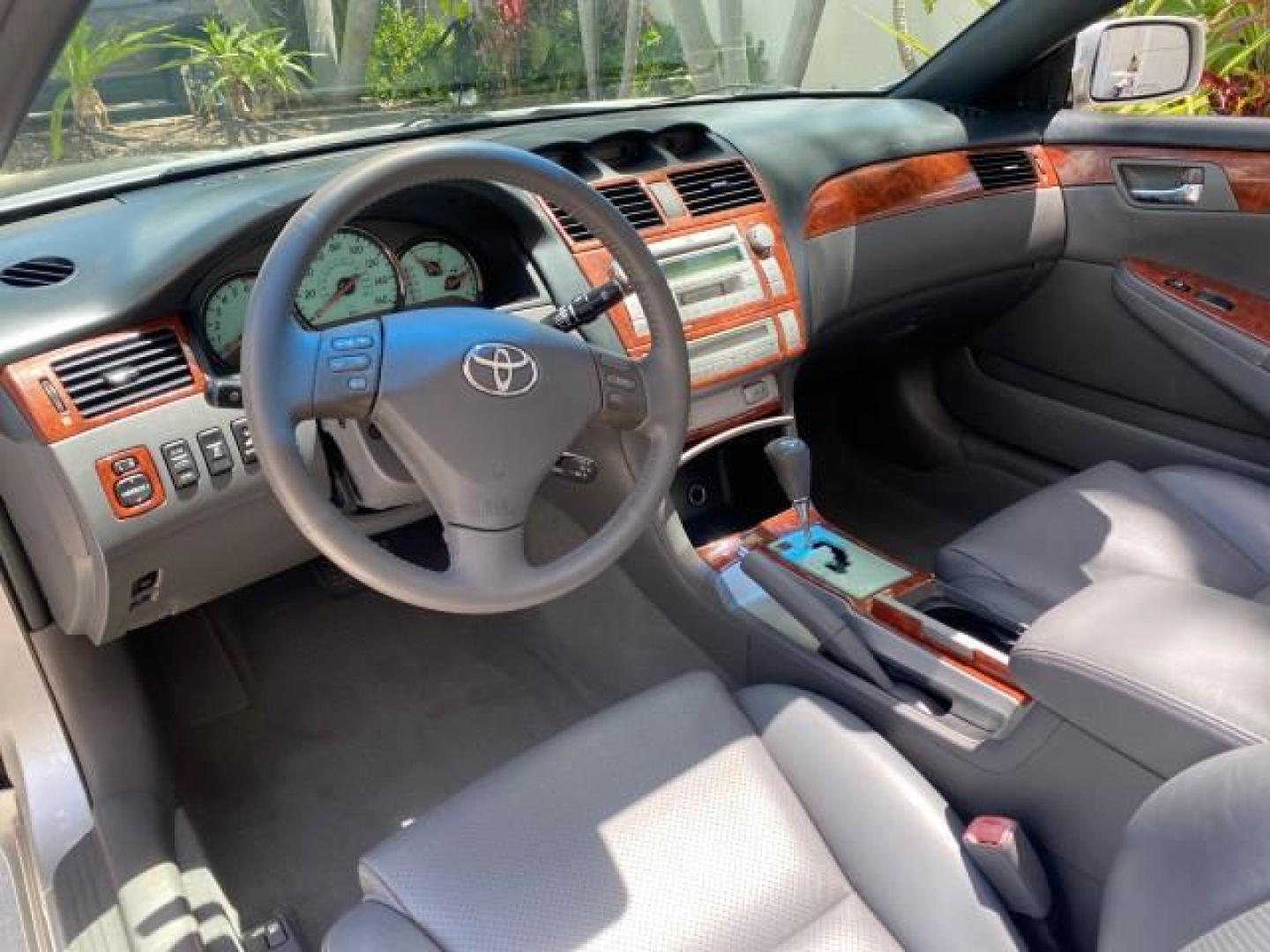 2006 Lunar Mist Metallic /Dark Stone Toyota Camry Solara SLE V6 LOW MILES 54,978 1 OWNER (4T1FA38P36U) with an 3.3L DOHC SMPI 24-Valve V6 Engine engine, Automatic transmission, located at 4701 North Dixie Hwy, Pompano Beach, FL, 33064, (954) 422-2889, 26.240938, -80.123474 - OUR WEBPAGE FLORIDACARS1.COM HAS OVER 100 PHOTOS AND FREE CARFAX LINK 2006 Toyota Camry Solara SLE V6 1 OWNER LEATHER LOADED ABSOLUTELY NO CRACKS ON THE DASH Convertible 3.3L V6 F DOHC 24V Gasoline 28 MPG Front Wheel Drive Features ABS Brakes Air Conditioning Alloy Wheels AM/FM Stereo Automatic Tran - Photo#66