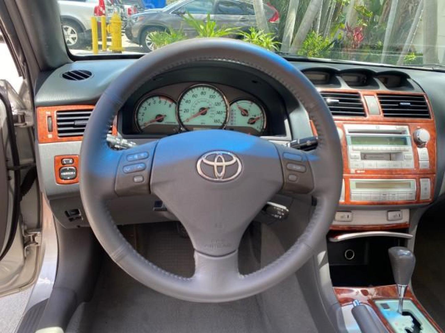 2006 Lunar Mist Metallic /Dark Stone Toyota Camry Solara SLE V6 LOW MILES 54,978 1 OWNER (4T1FA38P36U) with an 3.3L DOHC SMPI 24-Valve V6 Engine engine, Automatic transmission, located at 4701 North Dixie Hwy, Pompano Beach, FL, 33064, (954) 422-2889, 26.240938, -80.123474 - OUR WEBPAGE FLORIDACARS1.COM HAS OVER 100 PHOTOS AND FREE CARFAX LINK 2006 Toyota Camry Solara SLE V6 1 OWNER LEATHER LOADED ABSOLUTELY NO CRACKS ON THE DASH Convertible 3.3L V6 F DOHC 24V Gasoline 28 MPG Front Wheel Drive Features ABS Brakes Air Conditioning Alloy Wheels AM/FM Stereo Automatic Tran - Photo#67