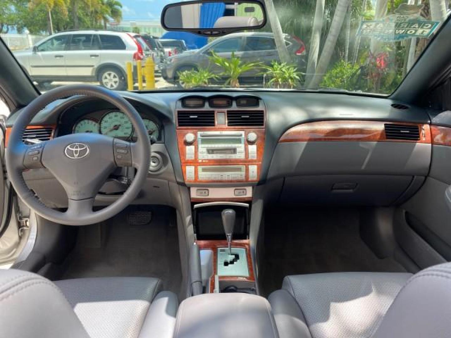 2006 Lunar Mist Metallic /Dark Stone Toyota Camry Solara SLE V6 LOW MILES 54,978 1 OWNER (4T1FA38P36U) with an 3.3L DOHC SMPI 24-Valve V6 Engine engine, Automatic transmission, located at 4701 North Dixie Hwy, Pompano Beach, FL, 33064, (954) 422-2889, 26.240938, -80.123474 - OUR WEBPAGE FLORIDACARS1.COM HAS OVER 100 PHOTOS AND FREE CARFAX LINK 2006 Toyota Camry Solara SLE V6 1 OWNER LEATHER LOADED ABSOLUTELY NO CRACKS ON THE DASH Convertible 3.3L V6 F DOHC 24V Gasoline 28 MPG Front Wheel Drive Features ABS Brakes Air Conditioning Alloy Wheels AM/FM Stereo Automatic Tran - Photo#95