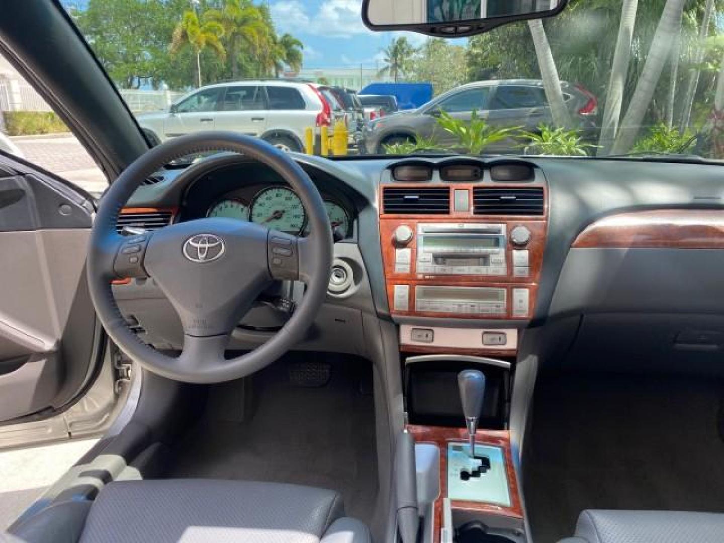 2006 Lunar Mist Metallic /Dark Stone Toyota Camry Solara SLE V6 LOW MILES 54,978 1 OWNER (4T1FA38P36U) with an 3.3L DOHC SMPI 24-Valve V6 Engine engine, Automatic transmission, located at 4701 North Dixie Hwy, Pompano Beach, FL, 33064, (954) 422-2889, 26.240938, -80.123474 - OUR WEBPAGE FLORIDACARS1.COM HAS OVER 100 PHOTOS AND FREE CARFAX LINK 2006 Toyota Camry Solara SLE V6 1 OWNER LEATHER LOADED ABSOLUTELY NO CRACKS ON THE DASH Convertible 3.3L V6 F DOHC 24V Gasoline 28 MPG Front Wheel Drive Features ABS Brakes Air Conditioning Alloy Wheels AM/FM Stereo Automatic Tran - Photo#96