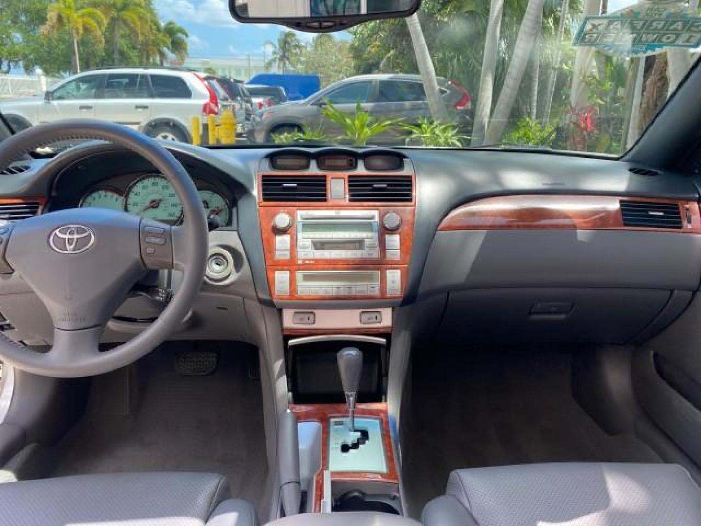 2006 Lunar Mist Metallic /Dark Stone Toyota Camry Solara SLE V6 LOW MILES 54,978 1 OWNER (4T1FA38P36U) with an 3.3L DOHC SMPI 24-Valve V6 Engine engine, Automatic transmission, located at 4701 North Dixie Hwy, Pompano Beach, FL, 33064, (954) 422-2889, 26.240938, -80.123474 - OUR WEBPAGE FLORIDACARS1.COM HAS OVER 100 PHOTOS AND FREE CARFAX LINK 2006 Toyota Camry Solara SLE V6 1 OWNER LEATHER LOADED ABSOLUTELY NO CRACKS ON THE DASH Convertible 3.3L V6 F DOHC 24V Gasoline 28 MPG Front Wheel Drive Features ABS Brakes Air Conditioning Alloy Wheels AM/FM Stereo Automatic Tran - Photo#97