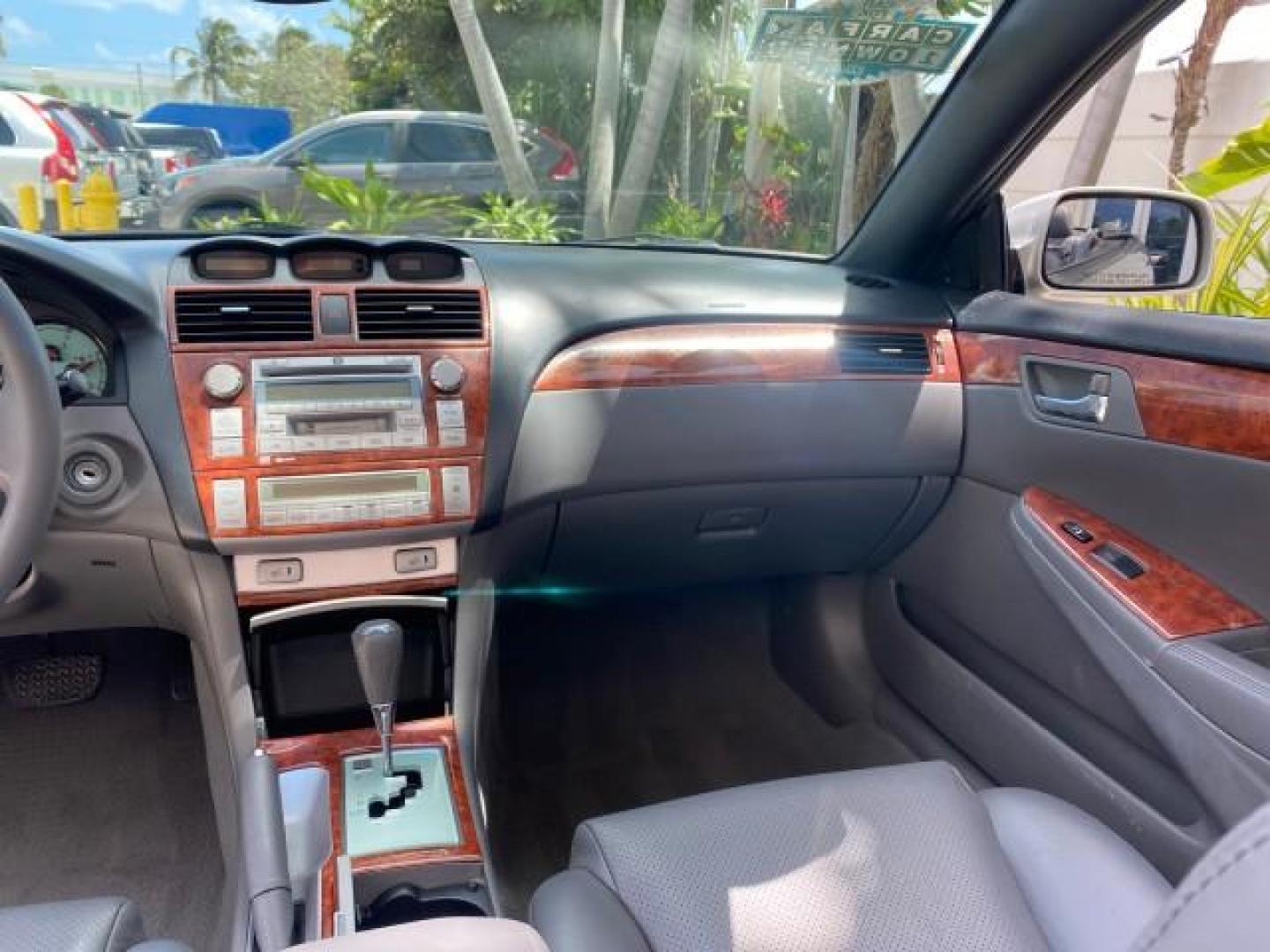 2006 Lunar Mist Metallic /Dark Stone Toyota Camry Solara SLE V6 LOW MILES 54,978 1 OWNER (4T1FA38P36U) with an 3.3L DOHC SMPI 24-Valve V6 Engine engine, Automatic transmission, located at 4701 North Dixie Hwy, Pompano Beach, FL, 33064, (954) 422-2889, 26.240938, -80.123474 - OUR WEBPAGE FLORIDACARS1.COM HAS OVER 100 PHOTOS AND FREE CARFAX LINK 2006 Toyota Camry Solara SLE V6 1 OWNER LEATHER LOADED ABSOLUTELY NO CRACKS ON THE DASH Convertible 3.3L V6 F DOHC 24V Gasoline 28 MPG Front Wheel Drive Features ABS Brakes Air Conditioning Alloy Wheels AM/FM Stereo Automatic Tran - Photo#98