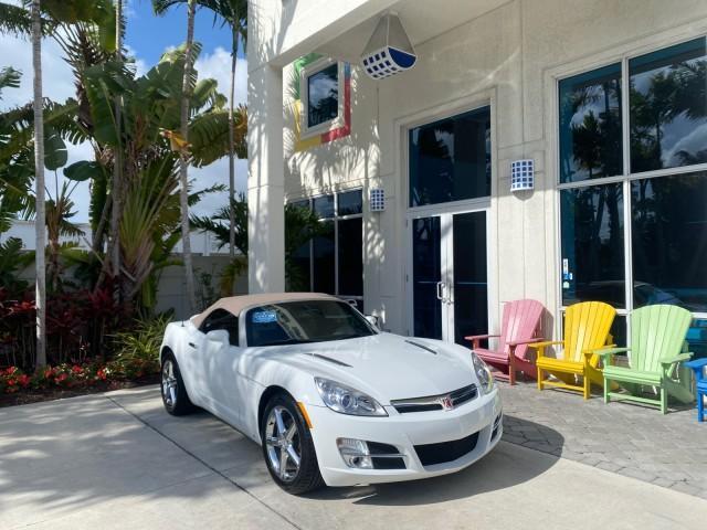 2007 Polar White /Tan Saturn Sky LOW MILES 21,329 5 SPEED MANUAL (1G8MB35B47Y) with an 2.4L DOHC VVT I4 Aluminum Ecotec Engine engine, Manual transmission, located at 4701 North Dixie Hwy, Pompano Beach, FL, 33064, (954) 422-2889, 26.240938, -80.123474 - OUR WEBPAGE FLORIDACARS1.COM HAS OVER 100 PHOTOS AND FREE CARFAX LINK 2007 Saturn SKY 5 SPEED MANUAL Convertible 2.4L I4 F DOHC Gasoline 28 MPG Rear Wheel Drive Features ABS Brakes Air Conditioning Alloy Wheels AM/FM Stereo Auxiliary Audio Input CD Audio Cruise Control Leather Seats Manual Transmiss - Photo#1