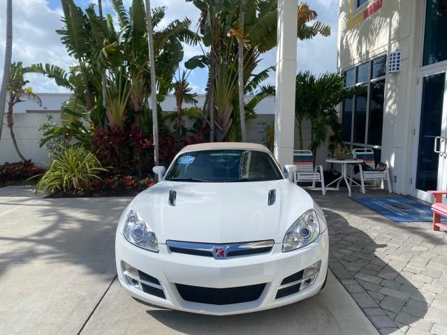 2007 Polar White /Tan Saturn Sky LOW MILES 21,329 5 SPEED MANUAL (1G8MB35B47Y) with an 2.4L DOHC VVT I4 Aluminum Ecotec Engine engine, Manual transmission, located at 4701 North Dixie Hwy, Pompano Beach, FL, 33064, (954) 422-2889, 26.240938, -80.123474 - OUR WEBPAGE FLORIDACARS1.COM HAS OVER 100 PHOTOS AND FREE CARFAX LINK 2007 Saturn SKY 5 SPEED MANUAL Convertible 2.4L I4 F DOHC Gasoline 28 MPG Rear Wheel Drive Features ABS Brakes Air Conditioning Alloy Wheels AM/FM Stereo Auxiliary Audio Input CD Audio Cruise Control Leather Seats Manual Transmiss - Photo#2