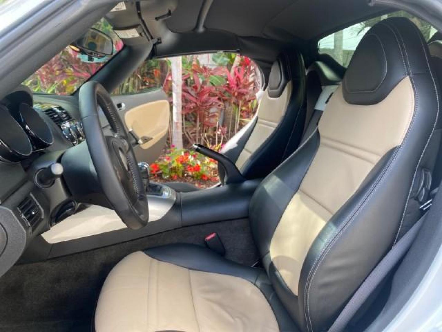 2007 Polar White /Tan Saturn Sky LOW MILES 21,329 5 SPEED MANUAL (1G8MB35B47Y) with an 2.4L DOHC VVT I4 Aluminum Ecotec Engine engine, Manual transmission, located at 4701 North Dixie Hwy, Pompano Beach, FL, 33064, (954) 422-2889, 26.240938, -80.123474 - OUR WEBPAGE FLORIDACARS1.COM HAS OVER 100 PHOTOS AND FREE CARFAX LINK 2007 Saturn SKY 5 SPEED MANUAL Convertible 2.4L I4 F DOHC Gasoline 28 MPG Rear Wheel Drive Features ABS Brakes Air Conditioning Alloy Wheels AM/FM Stereo Auxiliary Audio Input CD Audio Cruise Control Leather Seats Manual Transmiss - Photo#10