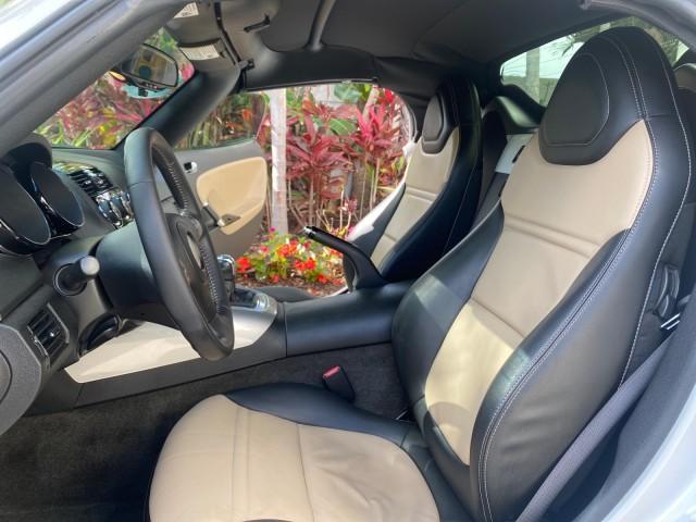 2007 Polar White /Tan Saturn Sky LOW MILES 21,329 5 SPEED MANUAL (1G8MB35B47Y) with an 2.4L DOHC VVT I4 Aluminum Ecotec Engine engine, Manual transmission, located at 4701 North Dixie Hwy, Pompano Beach, FL, 33064, (954) 422-2889, 26.240938, -80.123474 - OUR WEBPAGE FLORIDACARS1.COM HAS OVER 100 PHOTOS AND FREE CARFAX LINK 2007 Saturn SKY 5 SPEED MANUAL Convertible 2.4L I4 F DOHC Gasoline 28 MPG Rear Wheel Drive Features ABS Brakes Air Conditioning Alloy Wheels AM/FM Stereo Auxiliary Audio Input CD Audio Cruise Control Leather Seats Manual Transmiss - Photo#10