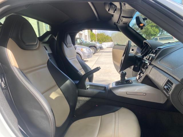 2007 Polar White /Tan Saturn Sky LOW MILES 21,329 5 SPEED MANUAL (1G8MB35B47Y) with an 2.4L DOHC VVT I4 Aluminum Ecotec Engine engine, Manual transmission, located at 4701 North Dixie Hwy, Pompano Beach, FL, 33064, (954) 422-2889, 26.240938, -80.123474 - OUR WEBPAGE FLORIDACARS1.COM HAS OVER 100 PHOTOS AND FREE CARFAX LINK 2007 Saturn SKY 5 SPEED MANUAL Convertible 2.4L I4 F DOHC Gasoline 28 MPG Rear Wheel Drive Features ABS Brakes Air Conditioning Alloy Wheels AM/FM Stereo Auxiliary Audio Input CD Audio Cruise Control Leather Seats Manual Transmiss - Photo#12