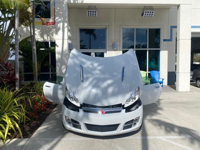 2007 Polar White /Tan Saturn Sky LOW MILES 21,329 5 SPEED MANUAL (1G8MB35B47Y) with an 2.4L DOHC VVT I4 Aluminum Ecotec Engine engine, Manual transmission, located at 4701 North Dixie Hwy, Pompano Beach, FL, 33064, (954) 422-2889, 26.240938, -80.123474 - OUR WEBPAGE FLORIDACARS1.COM HAS OVER 100 PHOTOS AND FREE CARFAX LINK 2007 Saturn SKY 5 SPEED MANUAL Convertible 2.4L I4 F DOHC Gasoline 28 MPG Rear Wheel Drive Features ABS Brakes Air Conditioning Alloy Wheels AM/FM Stereo Auxiliary Audio Input CD Audio Cruise Control Leather Seats Manual Transmiss - Photo#16
