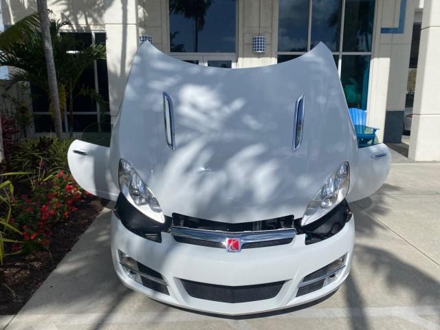 2007 Polar White /Tan Saturn Sky LOW MILES 21,329 5 SPEED MANUAL (1G8MB35B47Y) with an 2.4L DOHC VVT I4 Aluminum Ecotec Engine engine, Manual transmission, located at 4701 North Dixie Hwy, Pompano Beach, FL, 33064, (954) 422-2889, 26.240938, -80.123474 - OUR WEBPAGE FLORIDACARS1.COM HAS OVER 100 PHOTOS AND FREE CARFAX LINK 2007 Saturn SKY 5 SPEED MANUAL Convertible 2.4L I4 F DOHC Gasoline 28 MPG Rear Wheel Drive Features ABS Brakes Air Conditioning Alloy Wheels AM/FM Stereo Auxiliary Audio Input CD Audio Cruise Control Leather Seats Manual Transmiss - Photo#17