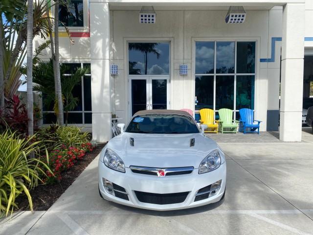 2007 Polar White /Tan Saturn Sky LOW MILES 21,329 5 SPEED MANUAL (1G8MB35B47Y) with an 2.4L DOHC VVT I4 Aluminum Ecotec Engine engine, Manual transmission, located at 4701 North Dixie Hwy, Pompano Beach, FL, 33064, (954) 422-2889, 26.240938, -80.123474 - OUR WEBPAGE FLORIDACARS1.COM HAS OVER 100 PHOTOS AND FREE CARFAX LINK 2007 Saturn SKY 5 SPEED MANUAL Convertible 2.4L I4 F DOHC Gasoline 28 MPG Rear Wheel Drive Features ABS Brakes Air Conditioning Alloy Wheels AM/FM Stereo Auxiliary Audio Input CD Audio Cruise Control Leather Seats Manual Transmiss - Photo#26