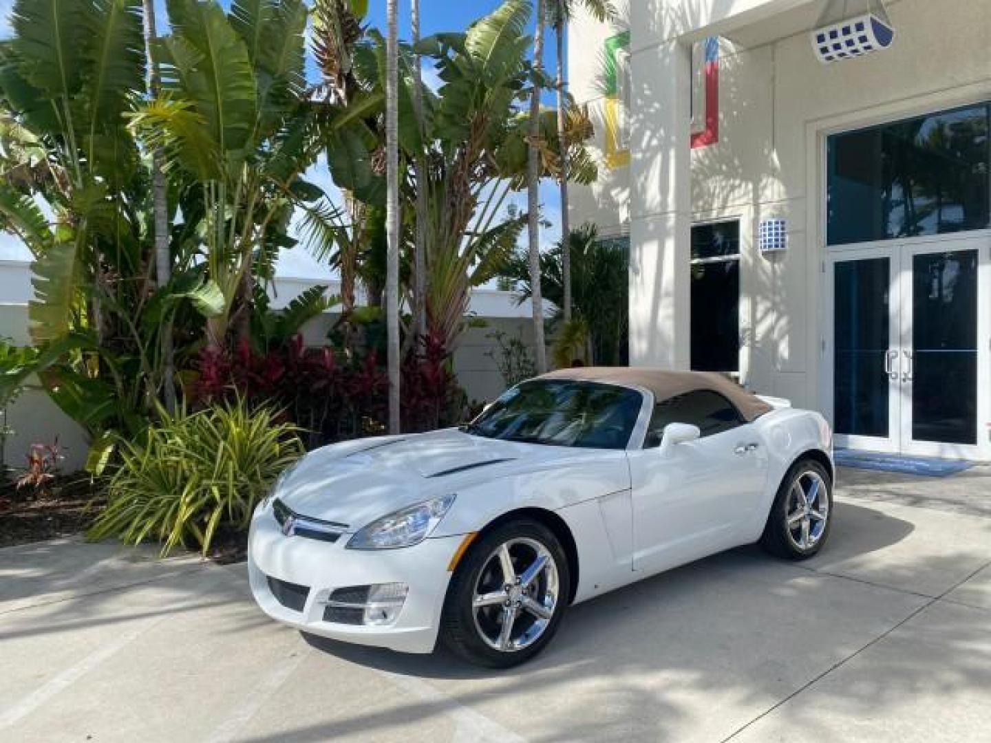 2007 Polar White /Tan Saturn Sky LOW MILES 21,329 5 SPEED MANUAL (1G8MB35B47Y) with an 2.4L DOHC VVT I4 Aluminum Ecotec Engine engine, Manual transmission, located at 4701 North Dixie Hwy, Pompano Beach, FL, 33064, (954) 422-2889, 26.240938, -80.123474 - OUR WEBPAGE FLORIDACARS1.COM HAS OVER 100 PHOTOS AND FREE CARFAX LINK 2007 Saturn SKY 5 SPEED MANUAL Convertible 2.4L I4 F DOHC Gasoline 28 MPG Rear Wheel Drive Features ABS Brakes Air Conditioning Alloy Wheels AM/FM Stereo Auxiliary Audio Input CD Audio Cruise Control Leather Seats Manual Transmiss - Photo#28