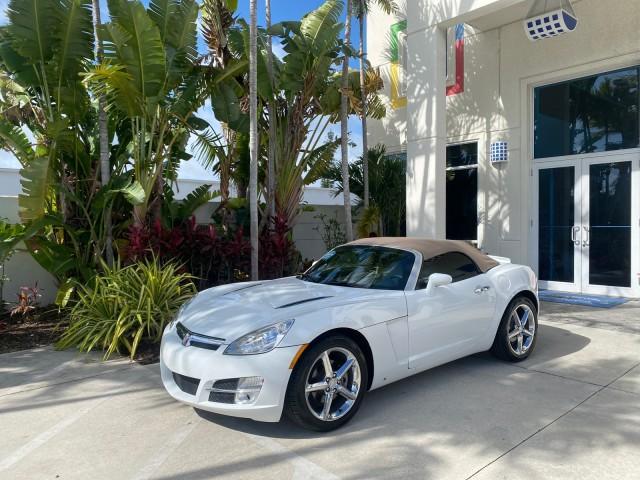 2007 Polar White /Tan Saturn Sky LOW MILES 21,329 5 SPEED MANUAL (1G8MB35B47Y) with an 2.4L DOHC VVT I4 Aluminum Ecotec Engine engine, Manual transmission, located at 4701 North Dixie Hwy, Pompano Beach, FL, 33064, (954) 422-2889, 26.240938, -80.123474 - OUR WEBPAGE FLORIDACARS1.COM HAS OVER 100 PHOTOS AND FREE CARFAX LINK 2007 Saturn SKY 5 SPEED MANUAL Convertible 2.4L I4 F DOHC Gasoline 28 MPG Rear Wheel Drive Features ABS Brakes Air Conditioning Alloy Wheels AM/FM Stereo Auxiliary Audio Input CD Audio Cruise Control Leather Seats Manual Transmiss - Photo#28