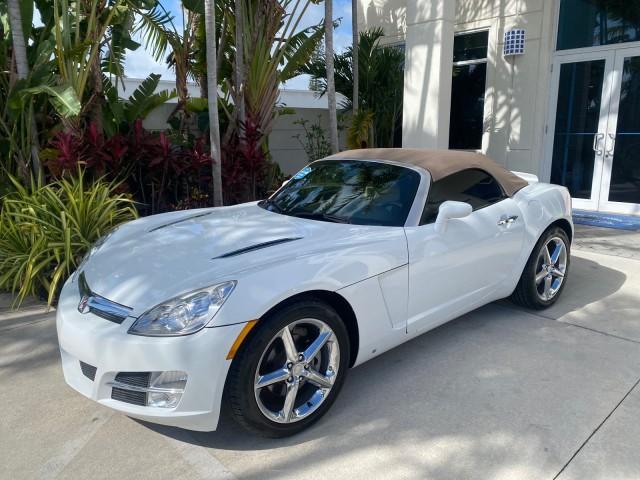 2007 Polar White /Tan Saturn Sky LOW MILES 21,329 5 SPEED MANUAL (1G8MB35B47Y) with an 2.4L DOHC VVT I4 Aluminum Ecotec Engine engine, Manual transmission, located at 4701 North Dixie Hwy, Pompano Beach, FL, 33064, (954) 422-2889, 26.240938, -80.123474 - OUR WEBPAGE FLORIDACARS1.COM HAS OVER 100 PHOTOS AND FREE CARFAX LINK 2007 Saturn SKY 5 SPEED MANUAL Convertible 2.4L I4 F DOHC Gasoline 28 MPG Rear Wheel Drive Features ABS Brakes Air Conditioning Alloy Wheels AM/FM Stereo Auxiliary Audio Input CD Audio Cruise Control Leather Seats Manual Transmiss - Photo#29