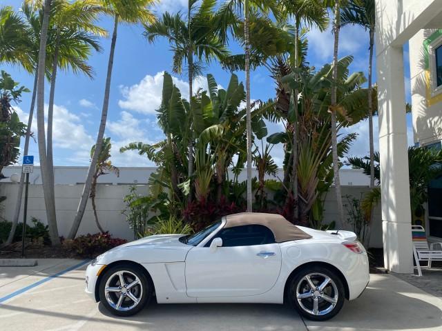 2007 Polar White /Tan Saturn Sky LOW MILES 21,329 5 SPEED MANUAL (1G8MB35B47Y) with an 2.4L DOHC VVT I4 Aluminum Ecotec Engine engine, Manual transmission, located at 4701 North Dixie Hwy, Pompano Beach, FL, 33064, (954) 422-2889, 26.240938, -80.123474 - OUR WEBPAGE FLORIDACARS1.COM HAS OVER 100 PHOTOS AND FREE CARFAX LINK 2007 Saturn SKY 5 SPEED MANUAL Convertible 2.4L I4 F DOHC Gasoline 28 MPG Rear Wheel Drive Features ABS Brakes Air Conditioning Alloy Wheels AM/FM Stereo Auxiliary Audio Input CD Audio Cruise Control Leather Seats Manual Transmiss - Photo#30