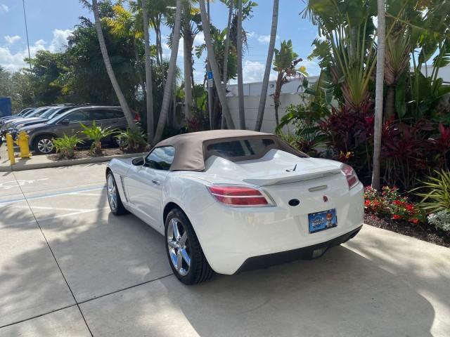 2007 Polar White /Tan Saturn Sky LOW MILES 21,329 5 SPEED MANUAL (1G8MB35B47Y) with an 2.4L DOHC VVT I4 Aluminum Ecotec Engine engine, Manual transmission, located at 4701 North Dixie Hwy, Pompano Beach, FL, 33064, (954) 422-2889, 26.240938, -80.123474 - OUR WEBPAGE FLORIDACARS1.COM HAS OVER 100 PHOTOS AND FREE CARFAX LINK 2007 Saturn SKY 5 SPEED MANUAL Convertible 2.4L I4 F DOHC Gasoline 28 MPG Rear Wheel Drive Features ABS Brakes Air Conditioning Alloy Wheels AM/FM Stereo Auxiliary Audio Input CD Audio Cruise Control Leather Seats Manual Transmiss - Photo#32