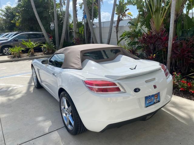 2007 Polar White /Tan Saturn Sky LOW MILES 21,329 5 SPEED MANUAL (1G8MB35B47Y) with an 2.4L DOHC VVT I4 Aluminum Ecotec Engine engine, Manual transmission, located at 4701 North Dixie Hwy, Pompano Beach, FL, 33064, (954) 422-2889, 26.240938, -80.123474 - OUR WEBPAGE FLORIDACARS1.COM HAS OVER 100 PHOTOS AND FREE CARFAX LINK 2007 Saturn SKY 5 SPEED MANUAL Convertible 2.4L I4 F DOHC Gasoline 28 MPG Rear Wheel Drive Features ABS Brakes Air Conditioning Alloy Wheels AM/FM Stereo Auxiliary Audio Input CD Audio Cruise Control Leather Seats Manual Transmiss - Photo#33