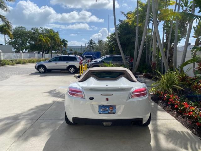 2007 Polar White /Tan Saturn Sky LOW MILES 21,329 5 SPEED MANUAL (1G8MB35B47Y) with an 2.4L DOHC VVT I4 Aluminum Ecotec Engine engine, Manual transmission, located at 4701 North Dixie Hwy, Pompano Beach, FL, 33064, (954) 422-2889, 26.240938, -80.123474 - OUR WEBPAGE FLORIDACARS1.COM HAS OVER 100 PHOTOS AND FREE CARFAX LINK 2007 Saturn SKY 5 SPEED MANUAL Convertible 2.4L I4 F DOHC Gasoline 28 MPG Rear Wheel Drive Features ABS Brakes Air Conditioning Alloy Wheels AM/FM Stereo Auxiliary Audio Input CD Audio Cruise Control Leather Seats Manual Transmiss - Photo#34